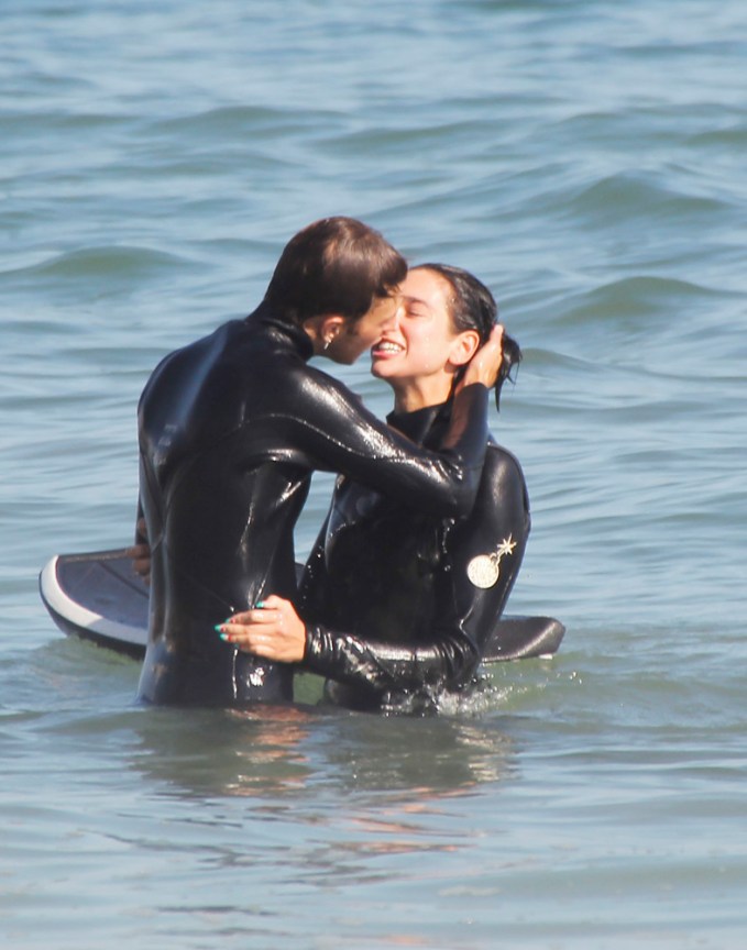 Dua Lipa & Anwar Hadid kiss while surfing in Malibu