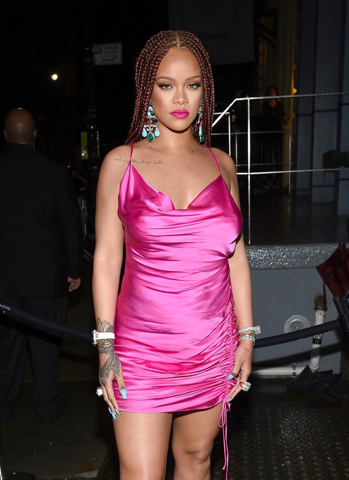 Rihanna wearing a hot pink dress