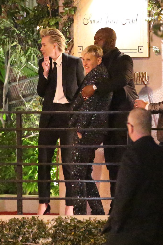 Ellen DeGeneres gets shielded from the strong LA winds as she and Portia de Rossi attend a Golden Globes party held at the Sunset Towers