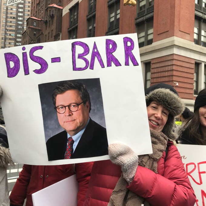 A Woman Holds A Chuck Barr Sign At Women’s March 2020