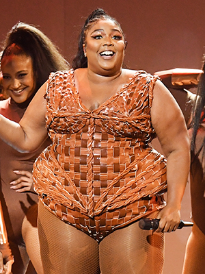 Lizzo puts curves on display in latticed leotard after donning delicious  chocolate gown at 2020 BRIT Awards – The US Sun