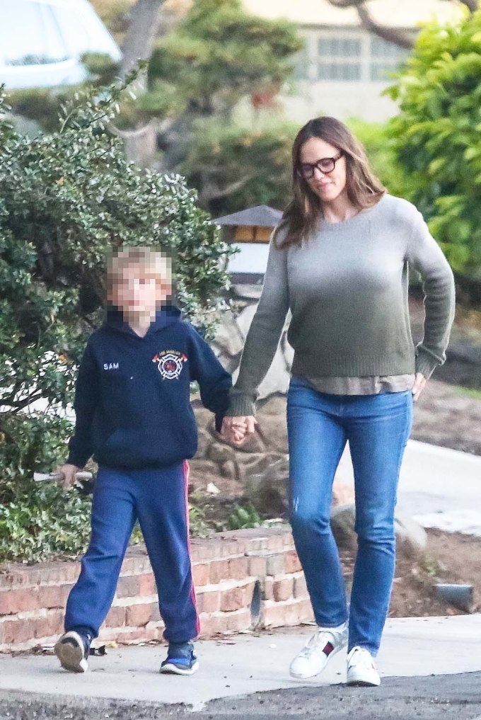 Jennifer Garner enjoys a late afternoon walk in her neighborhood with Samuel
