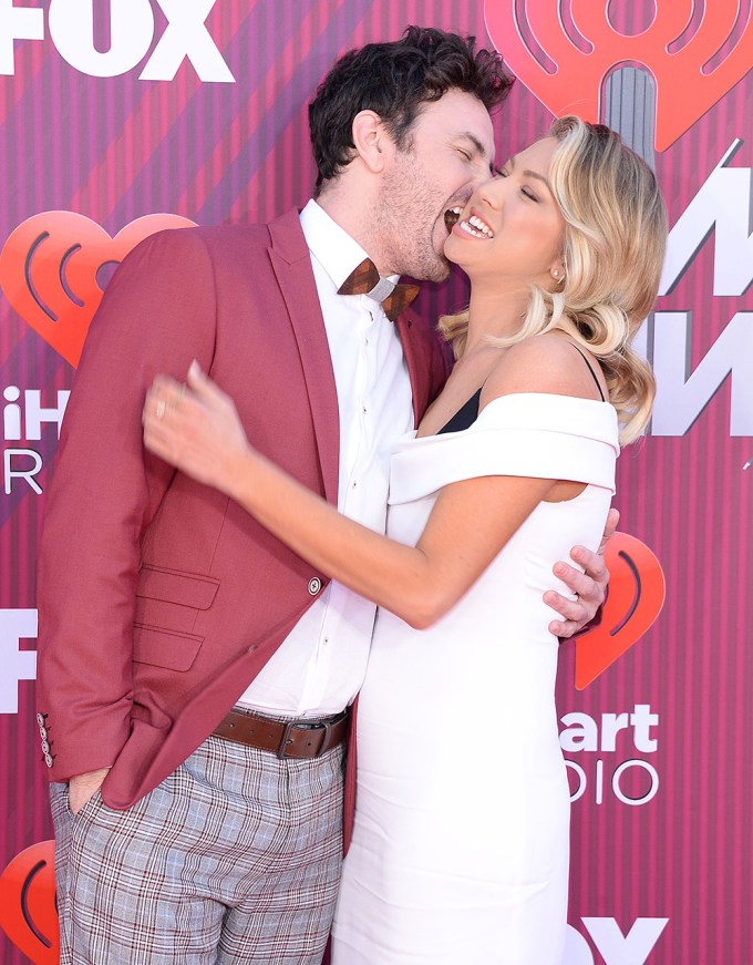 Stassi Schroeder & Beau Clark showing PDA at the 2019 iHeartRadio Music Awards