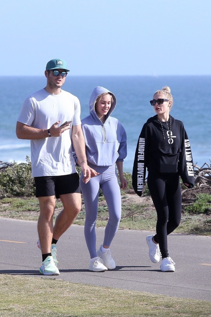 Colton Underwood and Cassie Randolph take a scenic walk with Cassie’s sister Michelle