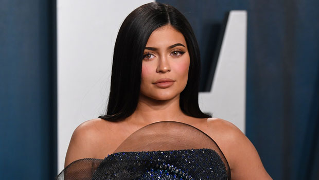 Kylie Jenner models a SKIMS top for sister Kim Kardashian with ring