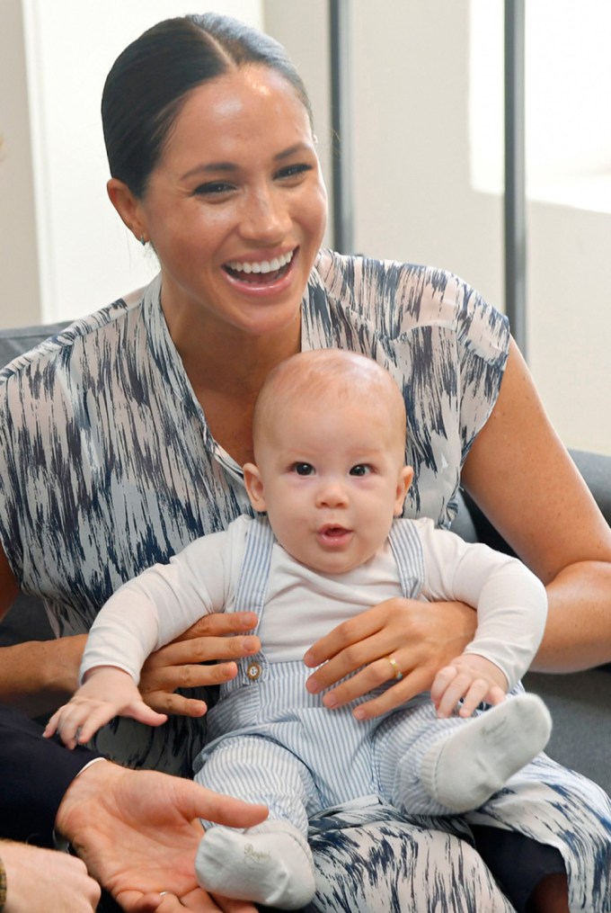 Meghan Markle laughs while holding son Archie