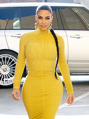 Kim Kardashian's Bodycon Yellow Dress + Strappy Sandals Are Trendy