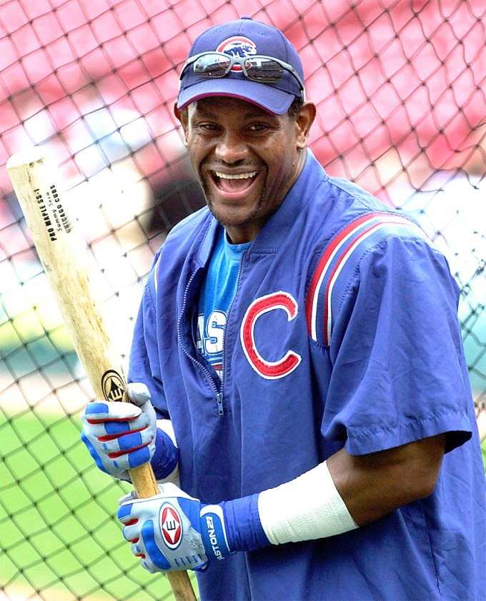 Sammy Sosa looks excited with a bat