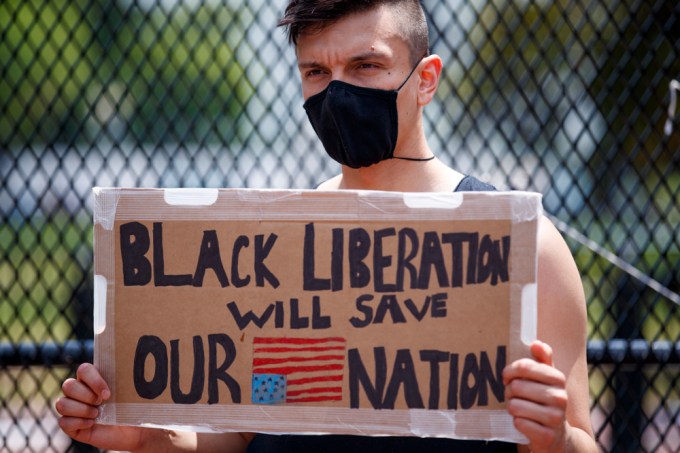 A protester holding a sign in Washington D.C.