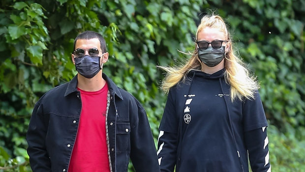 Pregnant Sophie Turner shows off baby bump in a mini dress and gray spandex  on a walk with husband Joe Jonas and parents – The US Sun
