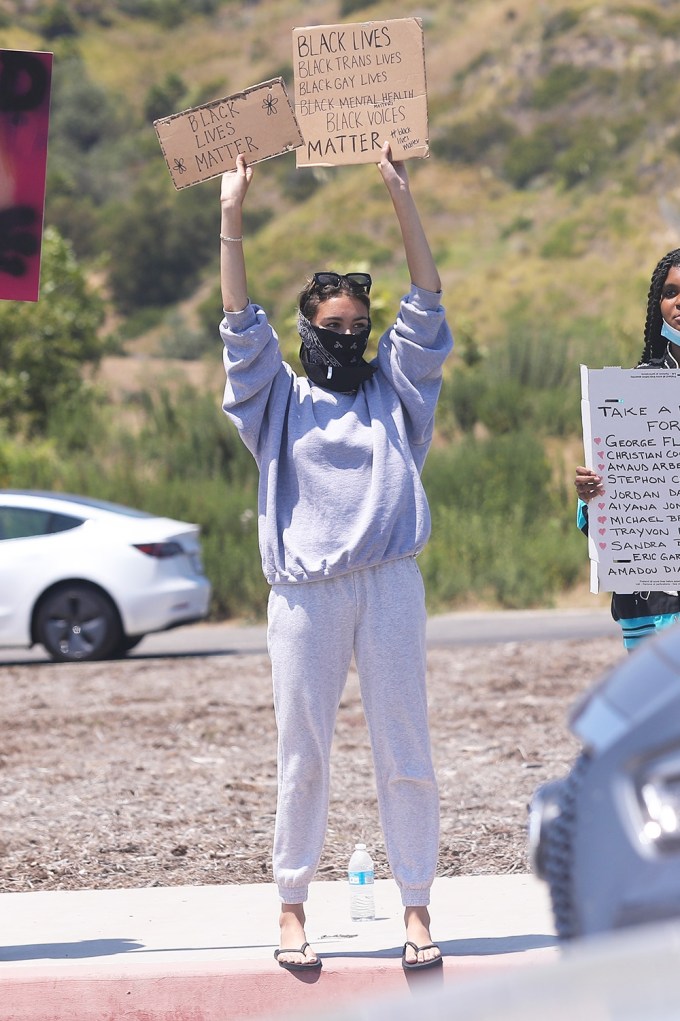 Madison Beer Holding Signs At Protest