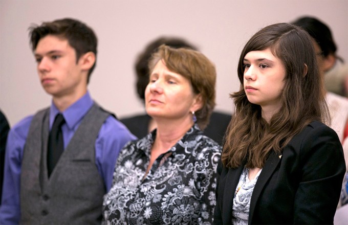 Nicole Maines stands with Jonas Maines and Kelly Maines, during a hearing before the Maine Supreme Court