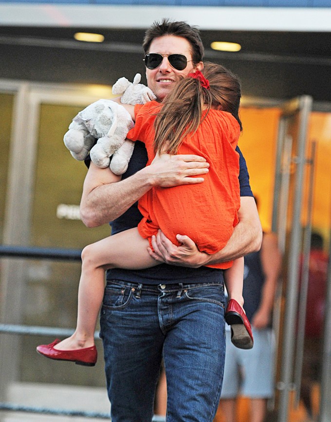 Tom Cruise holding Suri near the Chelsea Piers in NYC