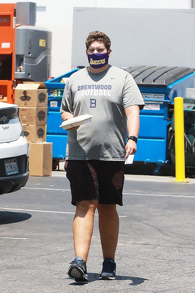Christopher Schwarzenegger with a face mask