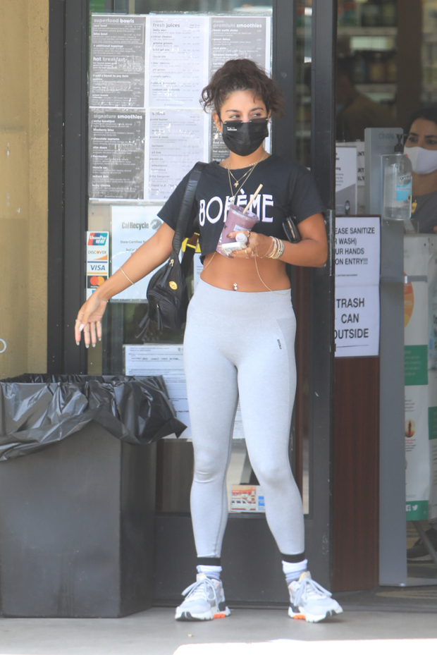 Vanessa Hudgens shows off her fit figure in black workout top and