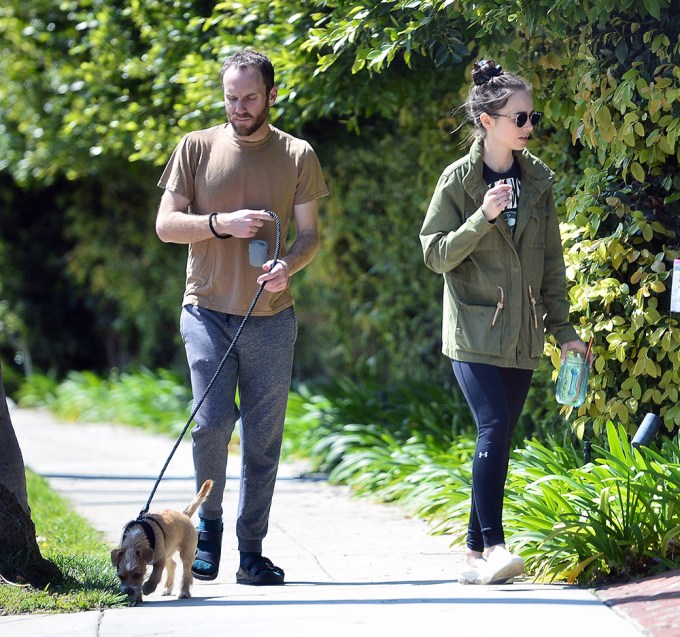 The Couple Walk Their Dog