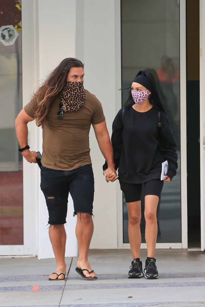 Scheana Shay and Brock Davies hold hands