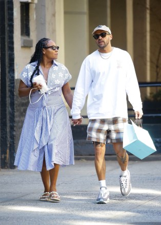 New York City, NY  - *EXCLUSIVE*  - Jesse Williams is spotted during a rare outing with longtime girlfriend Ciarra Pardo after having lunch together at Cipriani Downtown NYC in SoHo, New York City on Tuesday. The actor currently starring on Broadway's Take me Out cut a casual figure in plaid shorts that showed off what appeared to be a new eagle tattoo on his leg and a white crew topped with a baseball cap. Pardo, who is CEO at Mi Ojo + Co-Founder of LevelN4XT and counts Rihanna as a friend having served as Chief Creative Officer at Fenty Corp looked summer ready in a seersucker dress with embroidered flower details and tied just beneath her chest and paired it with pear accent sandals. The couple were seen checkin their phones during al fresco lunch and chatting closely before heading off hand in hand.Pictured: Jesse WilliamsBACKGRID USA 15 JUNE 2022 BYLINE MUST READ: Fernando Ramales / BACKGRIDUSA: +1 310 798 9111 / usasales@backgrid.comUK: +44 208 344 2007 / uksales@backgrid.com*UK Clients - Pictures Containing ChildrenPlease Pixelate Face Prior To Publication*