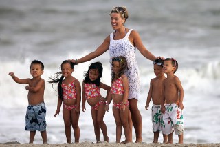 Kate Gosselin and her sextuplets pose for a family portrait by the sea on Bald Head Island, North Carolina, where they have been staying for more than a week without Kate's husband Jon. The picture was taken on Kate's pink phone by her nanny.

Pictured: Kate Gosselin and her sextuplets,Kate Gosselin
her sextuplets
Ref: SPL105144 050609 NON-EXCLUSIVE
Picture by: SplashNews.com

Splash News and Pictures
USA: +1 310-525-5808
London: +44 (0)20 8126 1009
Berlin: +49 175 3764 166
photodesk@splashnews.com

World Rights