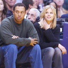 Tiger Woods and his girlfriend Elin Nordegren of Sweden sit courtside during the NBA game between the Los Angeles Lakers and the Houston Rockets February 18, 2003 at Staples Center in Los Angeles. Woods, who recently won the Buick Invitational in San Diego, will compete in the Nissan Open in Los Angeles this weekend.© 2003 Ramey Photo Agency   (310) 828-3445 (Mega Agency TagID: MEGAR109578_1[3].jpg) [Photo via Mega Agency]