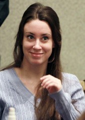 FILE - In this July 7, 2011 file photo, Casey Anthony smiles before the start of her sentencing hearing in Orlando, Fla.  On Tuesday, Oct. 25, 2011, the names of the jurors in the Casey Anthony trial were made public for the first time since they acquitted the Florida mother on charges of murdering her 2-year-old daughter, Caylee.    (AP Photo/Joe Burbank, File)