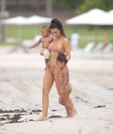 Kim Kardashian in white bikini.