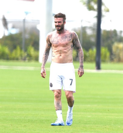 **MANDATORY BYLINE: SPLASH / MEGA** No game?  No problem!  David Beckham strips off his shirt for a kickaround after his MLS team's first home match was canceled amid the Coronavirus crisis.  Topless Becks showed off his tattooed torso on the pitch at Inter Miami CF’s Lockhart Stadium in Fort Lauderdale, Florida, on Saturday (march 14) - the day his new team was set to make their home debut against LA Galaxy.  Sons Brooklyn, Romeo and Cruz joined him for the informal footy session.  Since launching, Inter Miami has already had a run of bad luck, losing its first two matches, and now having its home debut postponed due to the global pandemic.  The MLS, along with the NBA and all major US sporting organizations, has suspended all games for 30 days.  Pictured: David Beckham Ref: SPL5156739 140320 NON-EXCLUSIVE Picture by: Mega/SplashNews.com Splash News and Pictures USA: +1 310-525-5808 London: +44 (0)20 8126 1009 Berlin: +49 175 3764 166 photodesk @splashnews.com World Rights