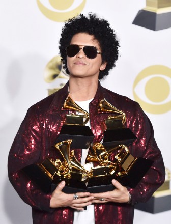 Bruno Mars poses in the press room with his awards for best R&B album, record of the year, album of the year, best engineered album, non-classical, for "24K Magic," and song of the year, best R&B performance and best R&B song, for "That's What I Like" at the 60th annual Grammy Awards at Madison Square Garden, in New York
60th Annual Grammy Awards - Press Room, New York, USA - 28 Jan 2018