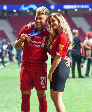 Editorial use only Required credit: Photo by BPI / Shutterstock (10265937xh) Liverpool's Alex Oxlade-Chamberlain celebrates with his girlfriend Perry Edwards of Little Mix Tottenham Hotspur v Liverpool, UEFA Champions League Champions League 01 Spa Final June 2019