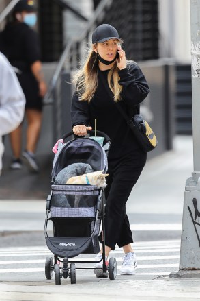 EXCLUSIVE: Kaley Cuoco Taking her dog for a stroll while drinking a smoothie in NYC. 16 Sep 2020 Pictured: Kaley Cuoco. Photo credit: MEGA TheMegaAgency.com +1 888 505 6342 (Mega Agency TagID: MEGA700980_002.jpg) [Photo via Mega Agency]