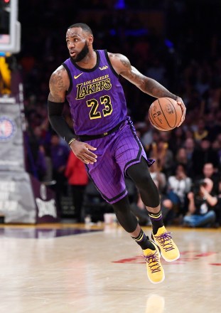 Los Angeles Lakers forward LeBron James dribbles during the second half of the team's NBA basketball game against the Portland Trail Blazers on Wednesday, Nov. 14, 2018, in Los Angeles. The Lakers won 126-117. (AP Photo/Mark J. Terrill)