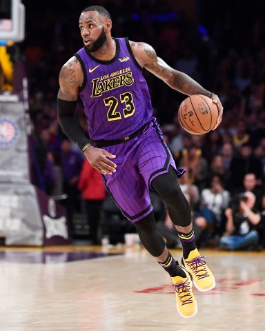 Los Angeles Lakers forward LeBron James dribbles during the second half of the team's NBA basketball game against the Portland Trail Blazers on Wednesday, Nov. 14, 2018, in Los Angeles. The Lakers won 126-117. (AP Photo/Mark J. Terrill)