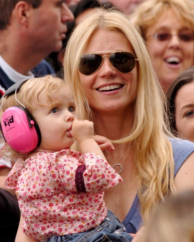 Live8 Concert in Hyde Park Gwyneth Paltrow and Her Daughter Apple Listening Tothe Opening of the Show and to Coldplay Whos Lead Singer Chris Martin is Apple's Father
Gwyneth Paltrow - 02 Jul 2005