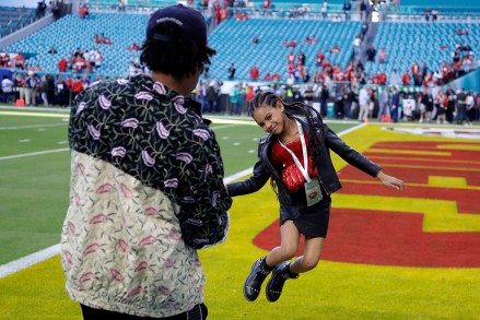 Entertainer Jay-Z watches his daughter Blue Ivy Carter leap on the field before the NFL Super Bowl 54 football game between the San Francisco 49ers and the Kansas City Chiefs, in Miami49ers Chiefs Super Bowl Football, Miami Gardens, USA - 02 Feb 2020