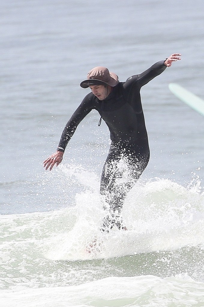 Adam Brody surfing