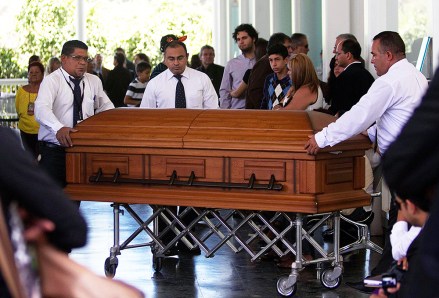 Funeral service workers push the coffin that contain the remains of Monica Spear, a popular soap-opera actress and former Miss Venezuela, into the East cemetery chapel in Caracas, Venezuela, . Assailants shot and killed Spear and her Irish ex-husband, Henry Thomas Berry, in the presence of their 5-year-old daughter when they resisted a robbery, authorities said. Spear and Berry were slain by the assailants late Monday night on a roadside near Puerto Cabello, Venezuela's main port, after their car broke down
Venezuela Slain Actress, Caracas, Venezuela