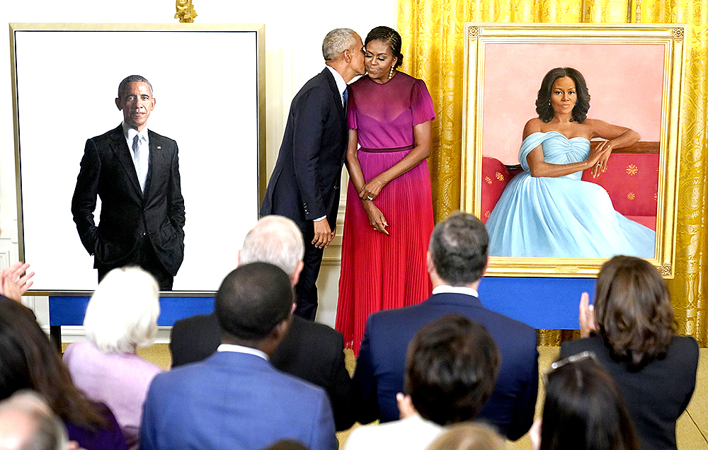 Former President Barack Obama kisses his wife former first lady Michelle Obama after they unveiled their official White House portraits during a ceremony for the unveiling in the East Room of the White House, in Washington
Biden Obama Portraits, Washington, United States - 07 Sep 2022