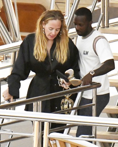 *EXCLUSIVE* SARDINIA, ITALY  - After postponing her concert residency at The Colosseum at Casears Palace a day before it was to start back in January,  Adele announced  today that she has officially rescheduled her shows. The English Singer was seen chilling out on a luxury boat out on the Sardinian coastline of Porto Cervo with her boyfriend Rich Paul on their Italian holiday with friends on Sunday. "Words can't explain how ecstatic I am to finally be able to announce these rescheduled shows. I truly was heartbroken to have to cancel them," the Grammy winner wrote on Instagram. "But after what feels like an eternity of figuring out logistics for the show that I really want to deliver, and knowing it can happen, I'm more excited than ever! Now I know for some of you it was a horrible decision on my part, and I will always be sorry for that, but I promise you it was the right one. To be with you in such an intimate space every week has been what I've most been looking forward to and I'm going to give you the absolute best of me."Her shows will now run from November 18 to March 23.Pictured: Adele and Rich PaulBACKGRID USA 25 JULY 2022 BYLINE MUST READ: FREZZA LA FATA - COBRA TEAM / BACKGRIDUSA: +1 310 798 9111 / usasales@backgrid.comUK: +44 208 344 2007 / uksales@backgrid.com*UK Clients - Pictures Containing ChildrenPlease Pixelate Face Prior To Publication*