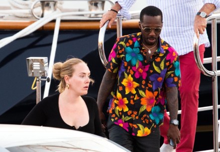 Sardinia, ITALY - Singer Adele looks in high spirits as she is seen with her boyfriend Rich Paul pictured enjoying their romantic vacation in Sardinia.The happy couple looked in good spirits while relaxing On a luxury yacht during their summer vacation in Sardinia, Adele looked fashionable in a black outfit with a matching Balenciaga handbag Pictured: Adele, Rich Paul: +44 208 344 2007 / uksales@backgrid.com *UK Customers - Images containing children, please rasterize face before posting*