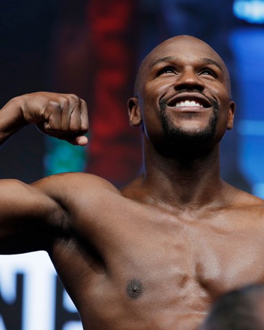 Floyd Mayweather Jr. poses on the scale during a weigh-in, in Las Vegas for his Saturday boxing bout against Conor McGregor
Mayweather McGregor Boxing, Las Vegas, USA - 25 Aug 2017