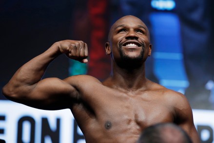 Floyd Mayweather Jr. poses on the scale during a weigh-in, in Las Vegas for his Saturday boxing bout against Conor McGregor
Mayweather McGregor Boxing, Las Vegas, USA - 25 Aug 2017