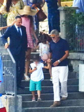 CERNOBBIO, ITALY - *EXCLUSIVE* - Actor George Clooney and his wife Amal enjoy their family holidays in the province of Como. The 61-year-old The Ocean's Eleven actor looked casual in his blue top during a boat ride with Amal who was stunned in her summer dress and hat, taking in the sights of their picturesque surroundings during the family trip. Pictured: George Clooney - Amal Clooney BACKGRID USA JULY 13, 2022 BYLINE MUST READ: COBRA TEAM / BACKGRIDUSA: +1 310 798 9111 / usasales@backgrid .comUK: +44 208 344 2007 / uksales@backgrid.com*UK Clients - Pictures Containing ChildrenPlease Pixelate Face Prior To Publication*