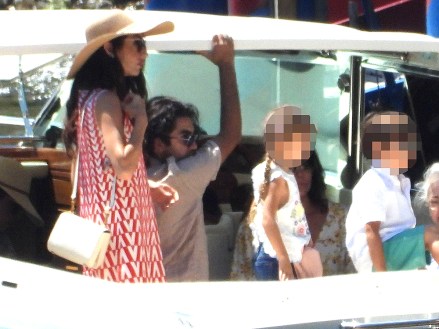 CERNOBBIO, ITALY - *EXCLUSIVE* - Actor George Clooney and his wife Amal enjoy their family holidays in the province of Como.The 61-year-old The Ocean's Eleven actor looked casual in his blue top during a boat ride with Amal who was stunned in her summer dress and hat, taking in the sights of their picturesque surroundings during the family trip.Pictured: George Clooney - Amal Clooney BACKGRID USA 13 JULY 2022 BYLINE MUST READ: COBRA TEAM / BACKGRIDUSA: +1 310 798 9111 / usasales@backgrid.comUK: +44 208 344 2007 / uksales@backgrid.com*UK Clients - Pictures Containing ChildrenPlease Pixelate Face Prior To Publication*