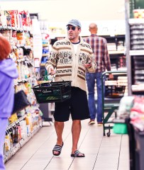 EXCLUSIVE: Jon Hamm Looked Cozingly Native In A Funky Sweater As He Grocery Shopped At Gelsons In Hollywood, CA. The Top Gun Star Was Seen Browsing The Aisles In Aviators and Flip Flops While Filling Up His Basket. 06 Jun 2022 Pictured: Jon Hamm. Photo credit: @CelebCandidly / MEGA TheMegaAgency.com +1 888 505 6342 (Mega Agency TagID: MEGA865788_003.jpg) [Photo via Mega Agency]