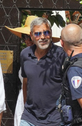 *EXCLUSIVE* Saint-Jean-Cap-Ferrat, FRANCE  - Actor George Clooney and wife Amal Clooney step out with best friends Cindy Crawford and her husband Randi Gerber for lunch at Le Plongeoir while vacationing in South of France.The Group looked in great spirits as they enjoyed lunch together chatting away before leaving and George was accosted for a selfie by some police officer's which he happily posed for!**SHOT ON 06/05/2022**Pictured: George Clooney, Amal Clooney, Cindy Crawford, Rande GerberBACKGRID USA 9 JUNE 2022 USA: +1 310 798 9111 / usasales@backgrid.comUK: +44 208 344 2007 / uksales@backgrid.com*UK Clients - Pictures Containing ChildrenPlease Pixelate Face Prior To Publication*
