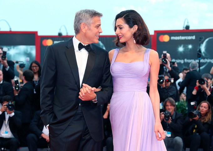 George & Amal Clooney Hold Hands
