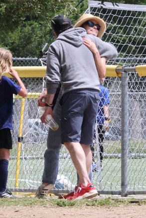 Los Angeles, CA  - *EXCLUSIVE*  - Hollywood A-Listers Olivia Wilde and Jason Sudeikis hug it out to support their son at a soccer game amid a custody battle.  Pictured: Olivia Wilde, Jason Sudeikis  BACKGRID USA 22 APRIL 2023   USA: +1 310 798 9111 / usasales@backgrid.com  UK: +44 208 344 2007 / uksales@backgrid.com  *UK Clients - Pictures Containing Children Please Pixelate Face Prior To Publication*