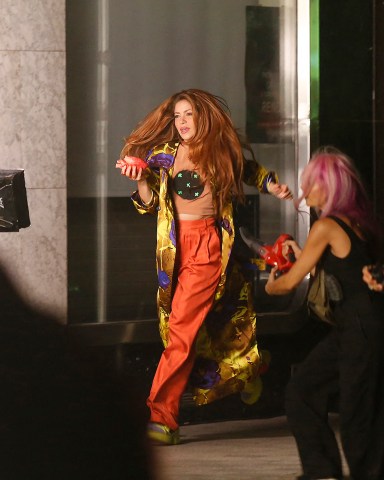 Shakira crying with a heart in her hand full of blood and a chroma key on her chest runs down a street in the center of Manresa a city of Barcelona while filming her new music video "Monotonia" with urban music singer Ozuna in the early hours of September 11 in Manresa, Barcelona, Spain. 11 Sep 2022 Pictured: Shakira. Photo credit: Elkin Cabarcas / MEGA TheMegaAgency.com +1 888 505 6342 (Mega Agency TagID: MEGA894671_001.jpg) [Photo via Mega Agency]