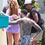 Shakira sparks new romance rumors as she enjoys a Miami boat trip with F1 ace Lewis Hamilton hours after the pair crossed paths at a fancy restaurant. The newly single and highly eligible bachelorette was picked up by the British-born racing star at the back of her own $20 million Miami Beach mansion on Wednesday. She was seen accepting Hamilton's offer of a hand, with the decorated Mercedes driver promptly got to his feet as she climbed aboard. They were accompanied on the cruise by heavily tattooed American fencer Miles Chamley-Watson, one of Hamilton's closest friends. It came the day after the two had crossed paths as Shakira made her way into Miami's upscale Cipriani restaurant, where Hamilton was dining out with pals on Tuesday evening. Speculation is now mounting around a potential new love match for the 46-year-old pop diva, who was also linked to Tom Cruise earlier this week amid reports the actor was "extremely interested" in pursuing her after they chatted at the Miami Grand Prix last weekend. But it seems she may be more interested in Hamilton, who competed in the flashy event. On Wednesday, she showed off her toned legs and torso in a flirty fringed lilac bikini top and matching shorts, wearing her famous long wavy hair loose over her shoulders. She was all smiles as she boarded the vessel which pulled up on Biscayne Bay behind her lavish waterfront pad. The 'Hips Don't Lie' songstress returned later on looking relaxed and went barefoot as she climbed back onto her personal dock. Shakira is newly single after splitting from soccer star Gerard Pique after 12 years. The former couple share two children, Sasha, 8, and Milan, 10. 10 May 2023 Pictured: Shakira and Lewis Hamilton. Photo credit: RM/MEGA TheMegaAgency.com +1 888 505 6342 (Mega Agency TagID: MEGA979957_001.jpg) [Photo via Mega Agency]