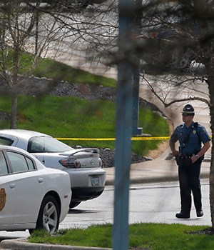 A Kansas State Trooper stands near the location of a shooting at the Jewish Community Center in Overland Park, KanFatal Shooting Kansas, Overland Park, USA - 13 Apr 2014